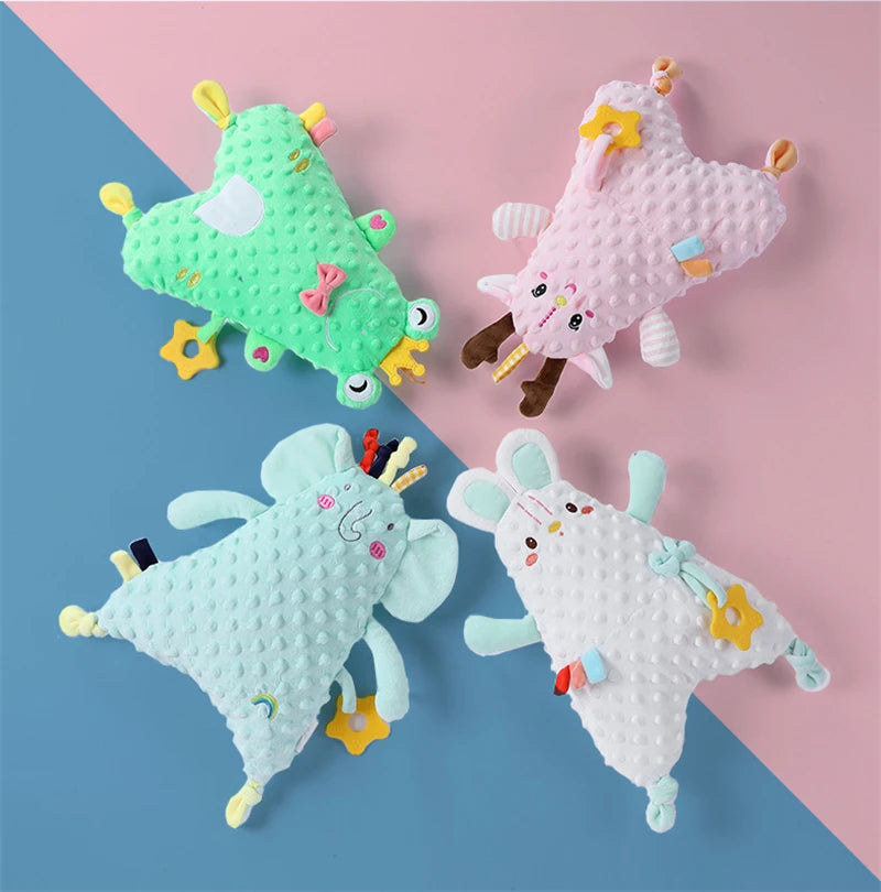 doudou cerf rose à tissu tout doux et anneau de dentition orange avec doudou souris bleue, doudou grenouille verte et doudou éléphant bleu / anneau de dentition Image