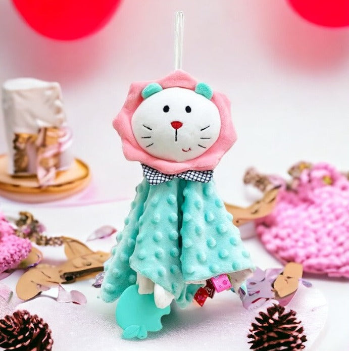 doudou lion bleu à tête blanche et crinière rose avec anneau de dentition en forme de pomme croquée Image
