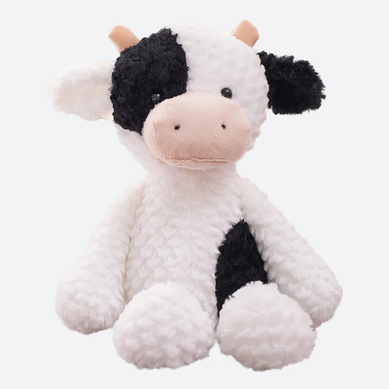 peluche vache blanche et noire avec petite cornes