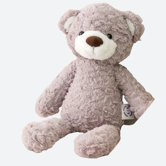 peluche ours brun au museau blanc