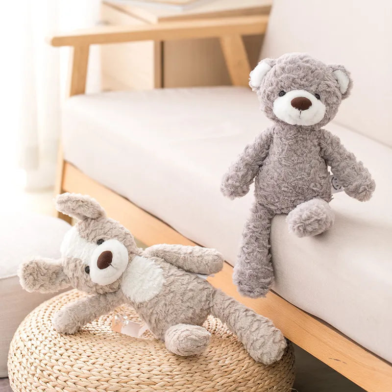 peluche ours brun au museau blanc avec peluche chien marron et blanc au nez marron Image