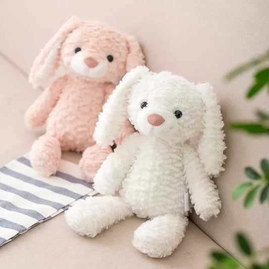 duo de peluches lapins, blanc et rose au pelage gauffré