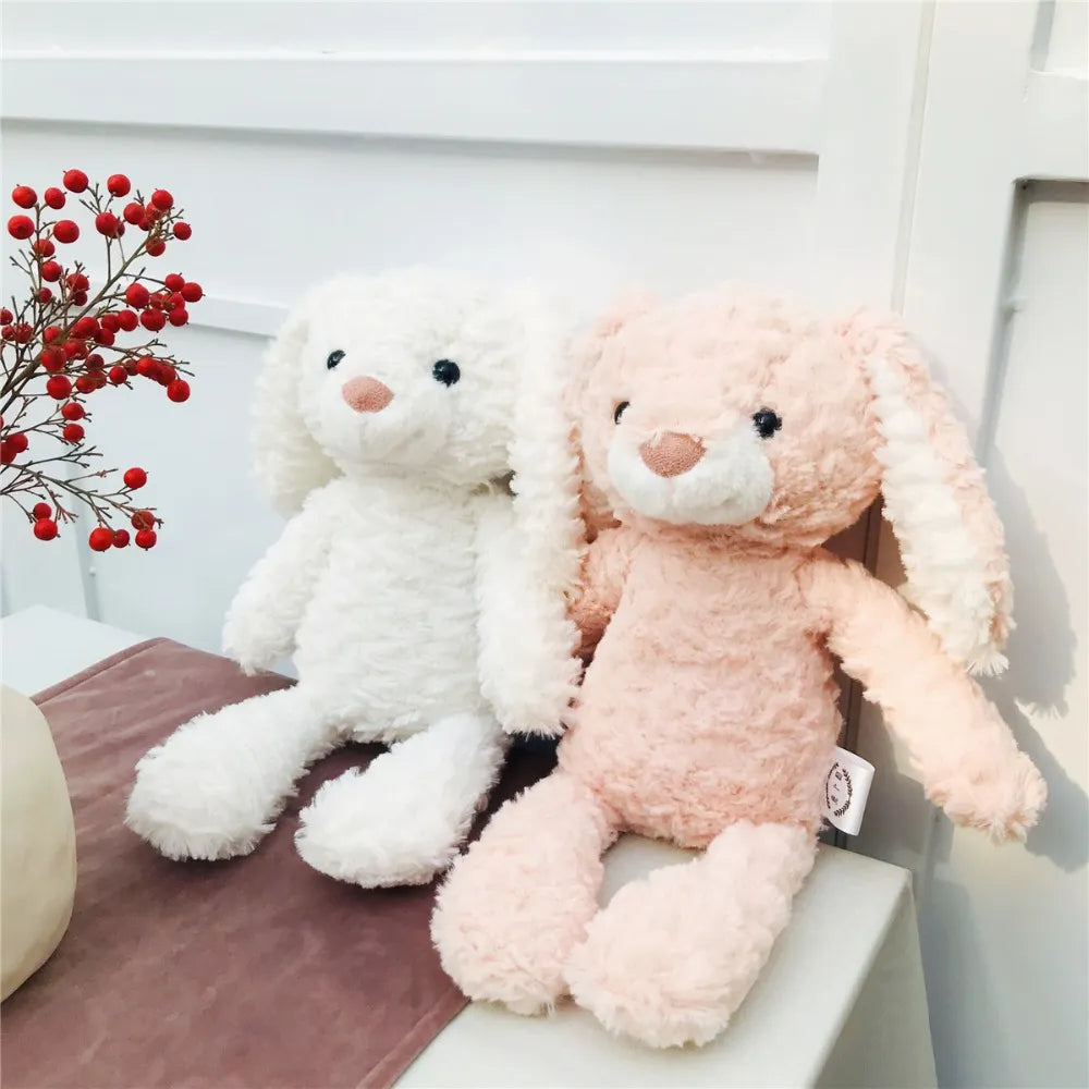 duo de peluches lapins, blanc et rose au pelage gauffré