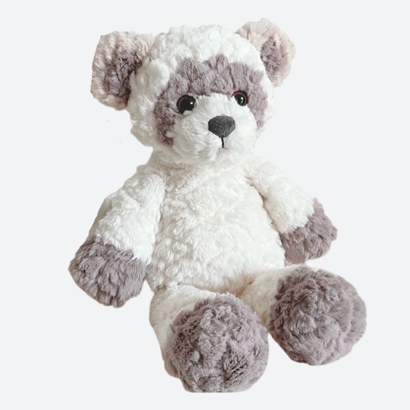  IDI, le doudou raton laveur, tout doux avec ses nuances de blanc et de marron. Avec son allure irrésistible, IDI est simplement trop mignon pour ne pas être adopté !