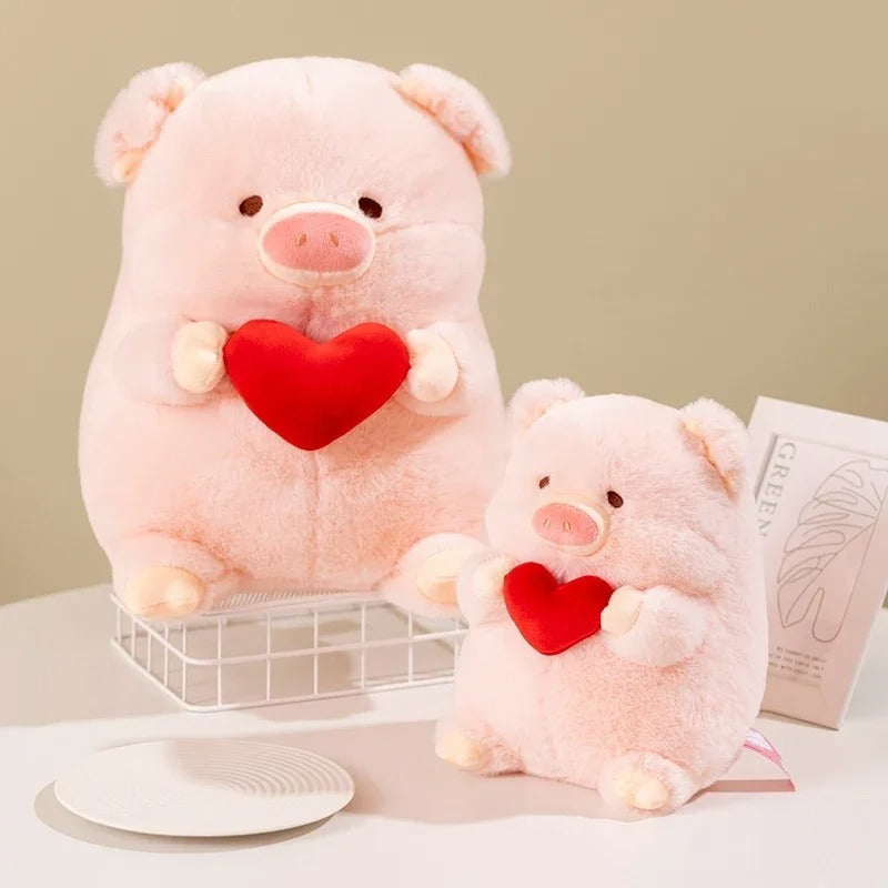 2 peluches cochon lover de face sur un décor Image