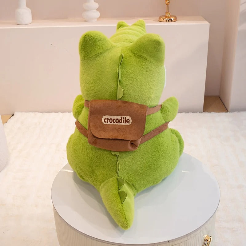 Peluche crocodile à sac à dos de dos avec vue sur le sac à dos Image