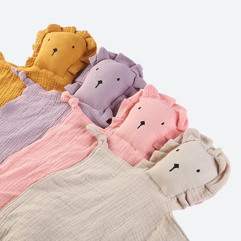 quatre doudous lion, orange, viole, rose, crème