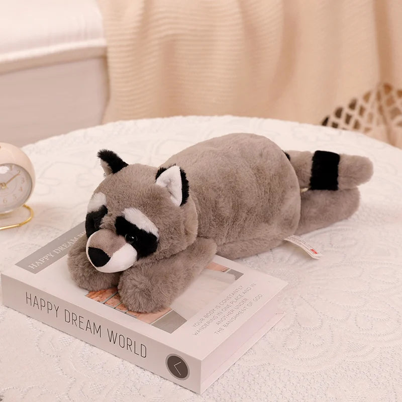 Découvrez le doudou géant raton laveur XL - STIVY, une peluche grise au regard malicieux. Disponible en trois tailles (45/60/70 cm Image