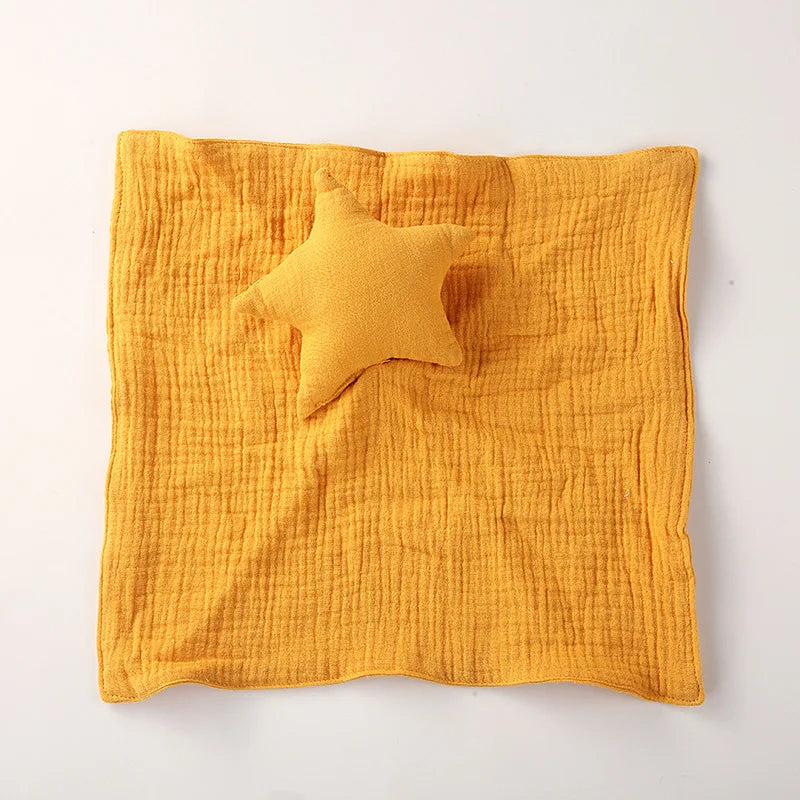 doudou étoile orange à plat