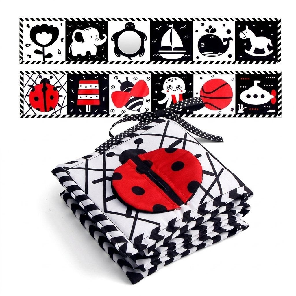 Livre accordéon en tissu noir et blanc, couverture coccinelle, avec miroir