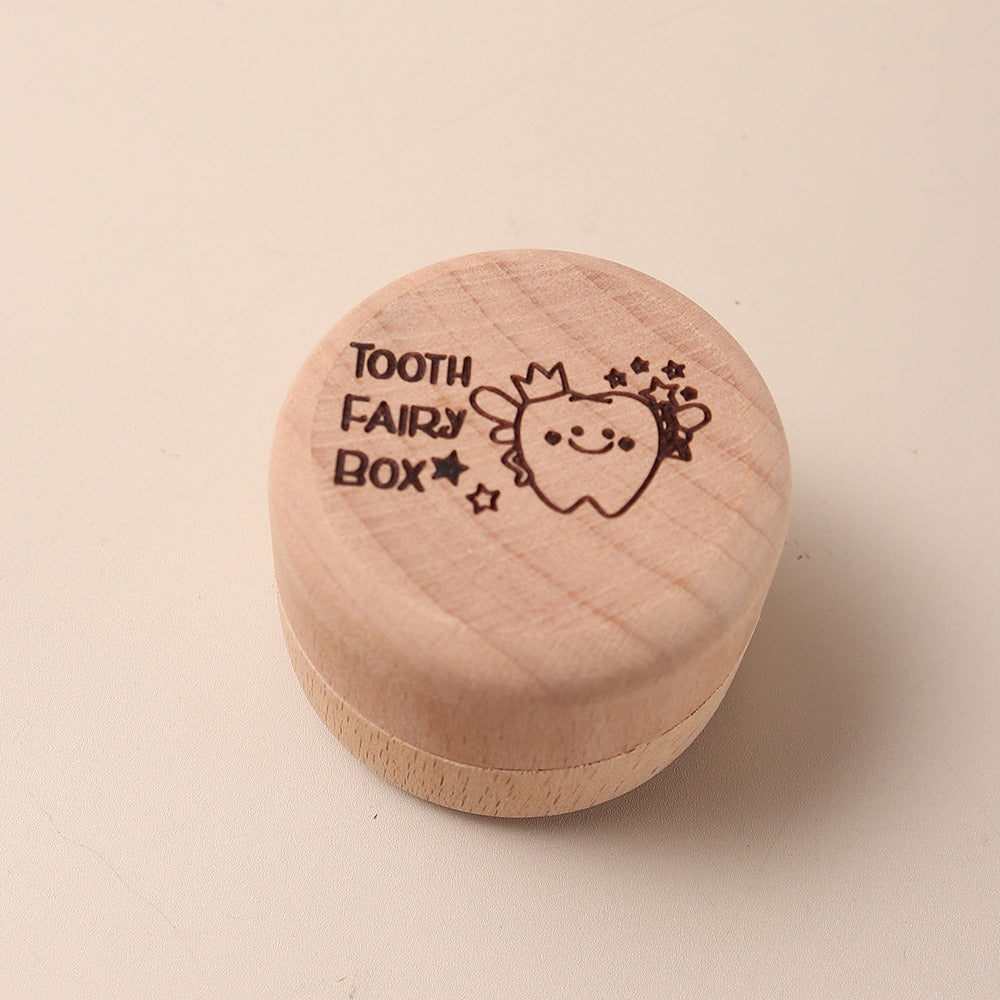 Boîte en bois gravée d'une dent pour la première dent