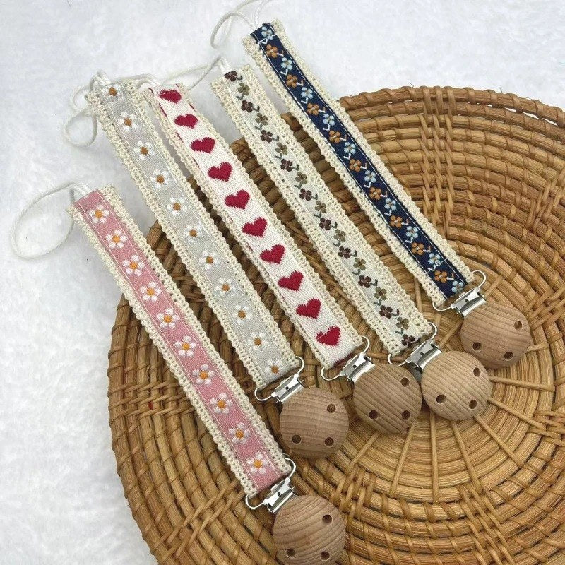 Attaches tétine ruban à fleurs dans plusieurs motifs