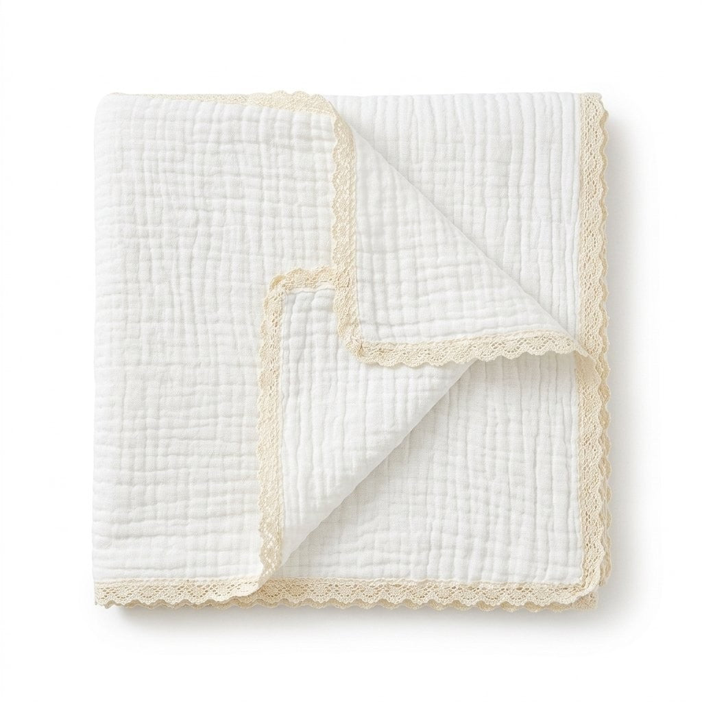 Couverture en gaze de coton écru, bordure dentelle