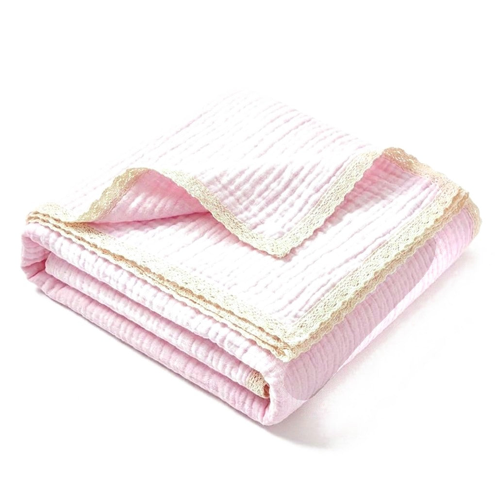 Couverture en gaze de coton rose poudré, bordure dentelle