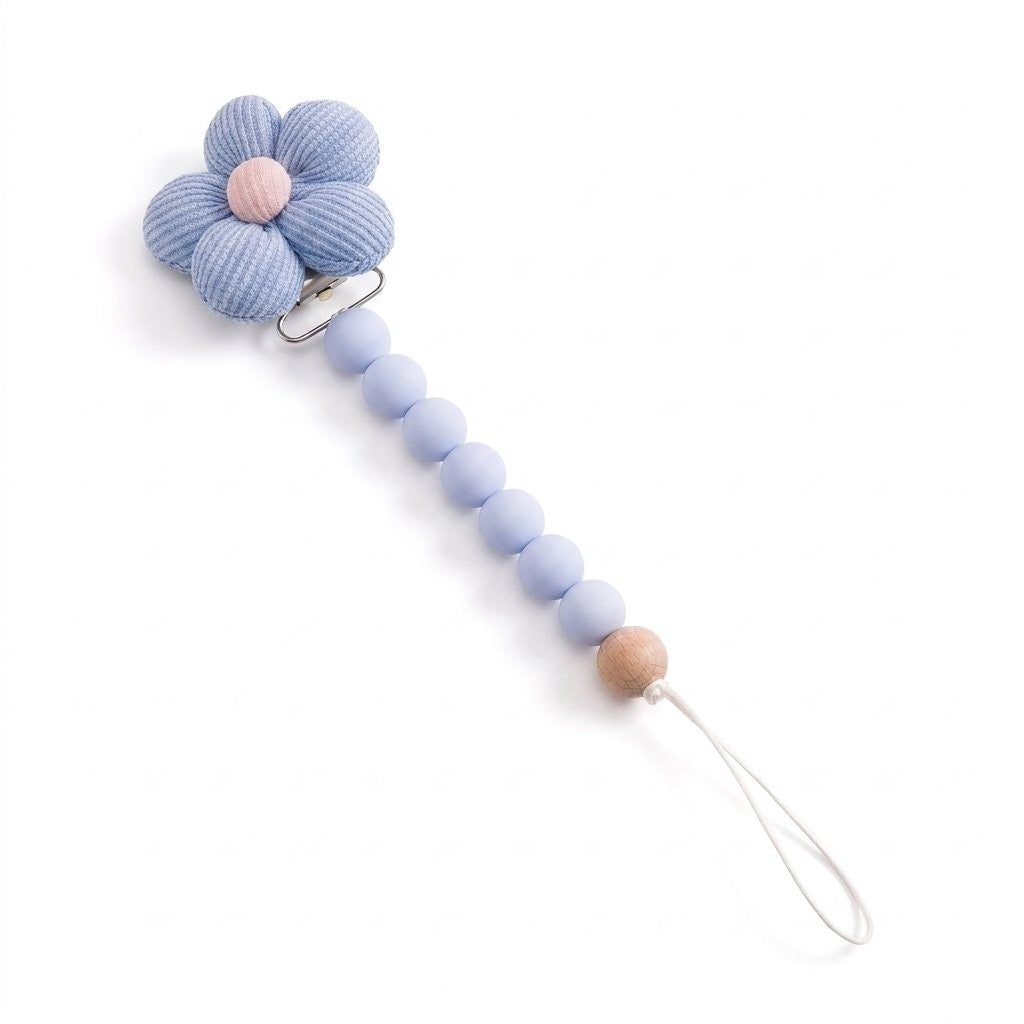 Attache-tétine fleur bleue au cœur rose et perles en silicone