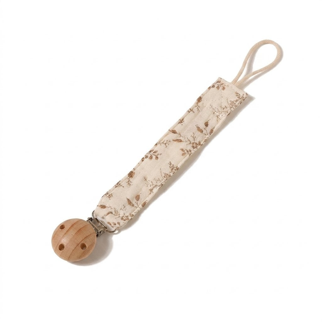 Attache-tétine en double gaze de coton imprimé feuillage brun