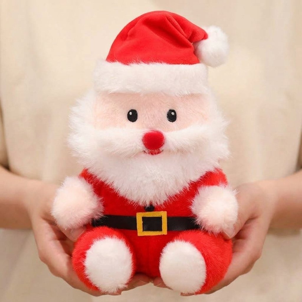 Peluche Père Noël NICOLAS tenue dans les mains