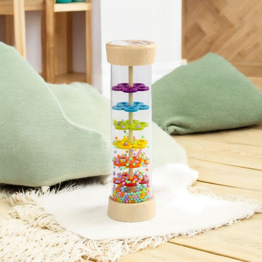 Bâton de pluie posé sur un tapis