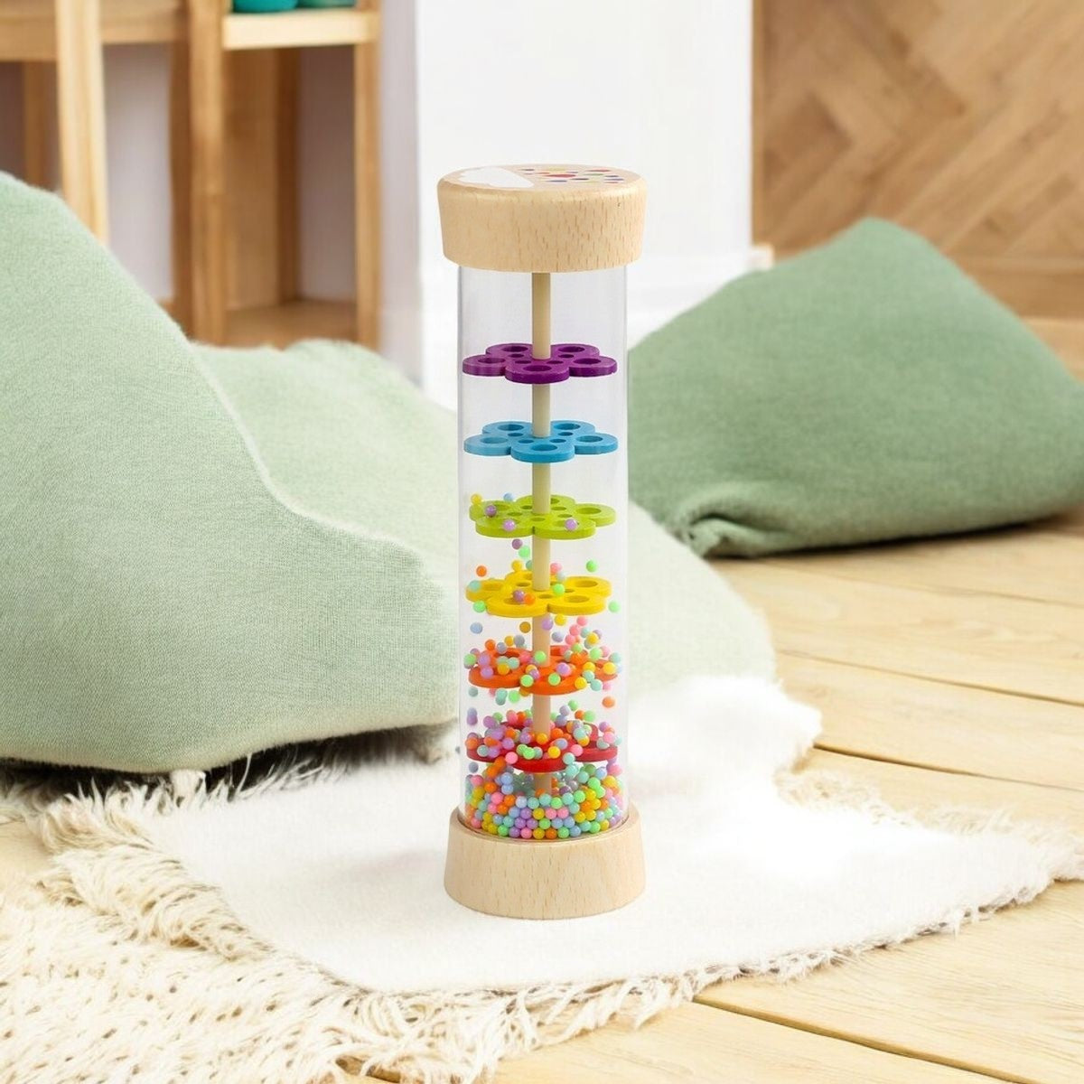 Bâton de pluie posé sur un tapis