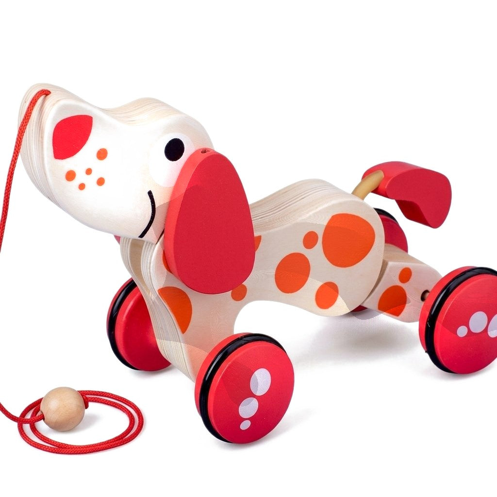 Chien à tirer en bois à taches rouges