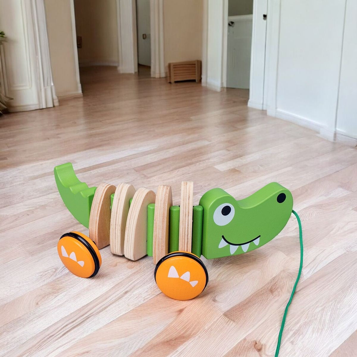 Crocodile à tirer sur un parquet, ficelle étendue Image