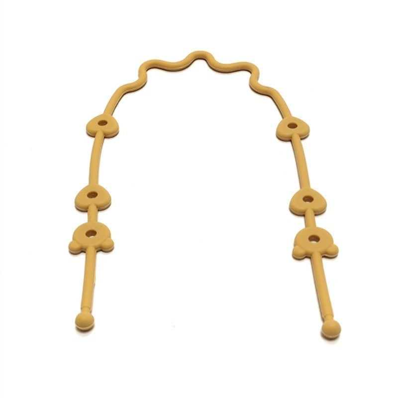 Attache jouet en silicone moutarde