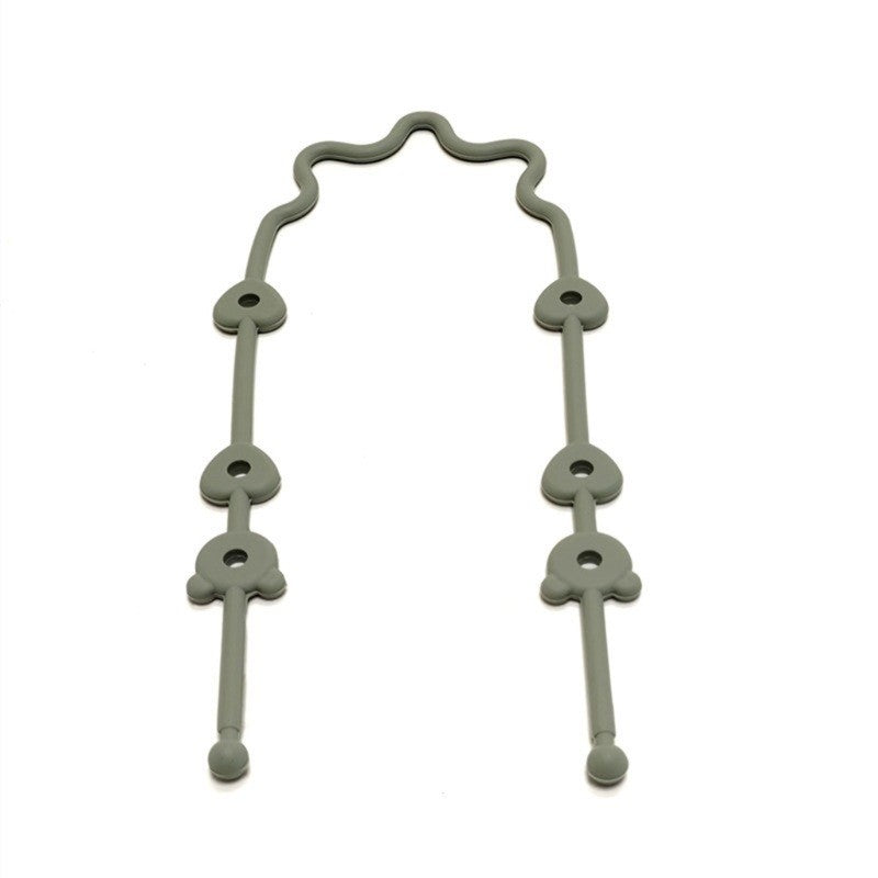 Attache jouet en silicone olive